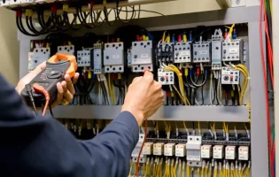 electrician-engineer-work-tester-measuring-voltage-current-power-electric-line-electical-cabinet-control-1024x683
